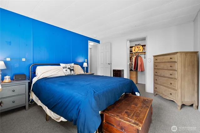 a bedroom with a bed and a closet