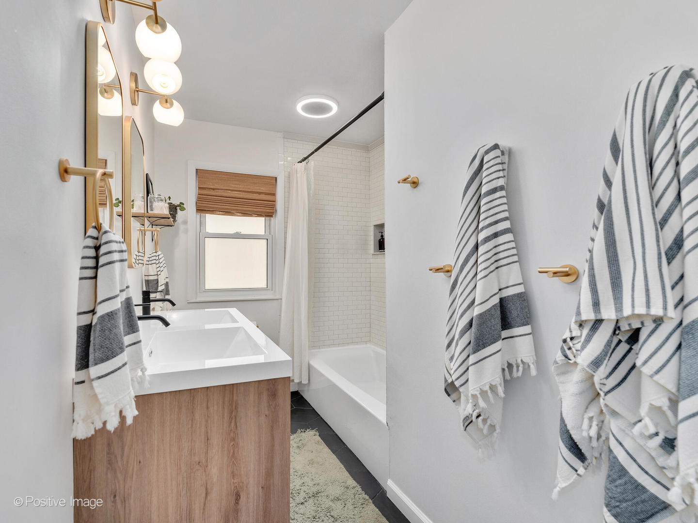503 Kipling Court Wheaton, IL 60187 - Photo 12 of 27 a bathroom with a bathtub sink a mirror and shower