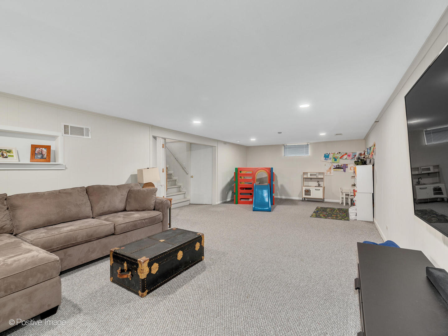 503 Kipling Court Wheaton, IL 60187 - Photo 16 of 27 a living room with furniture and a flat screen tv