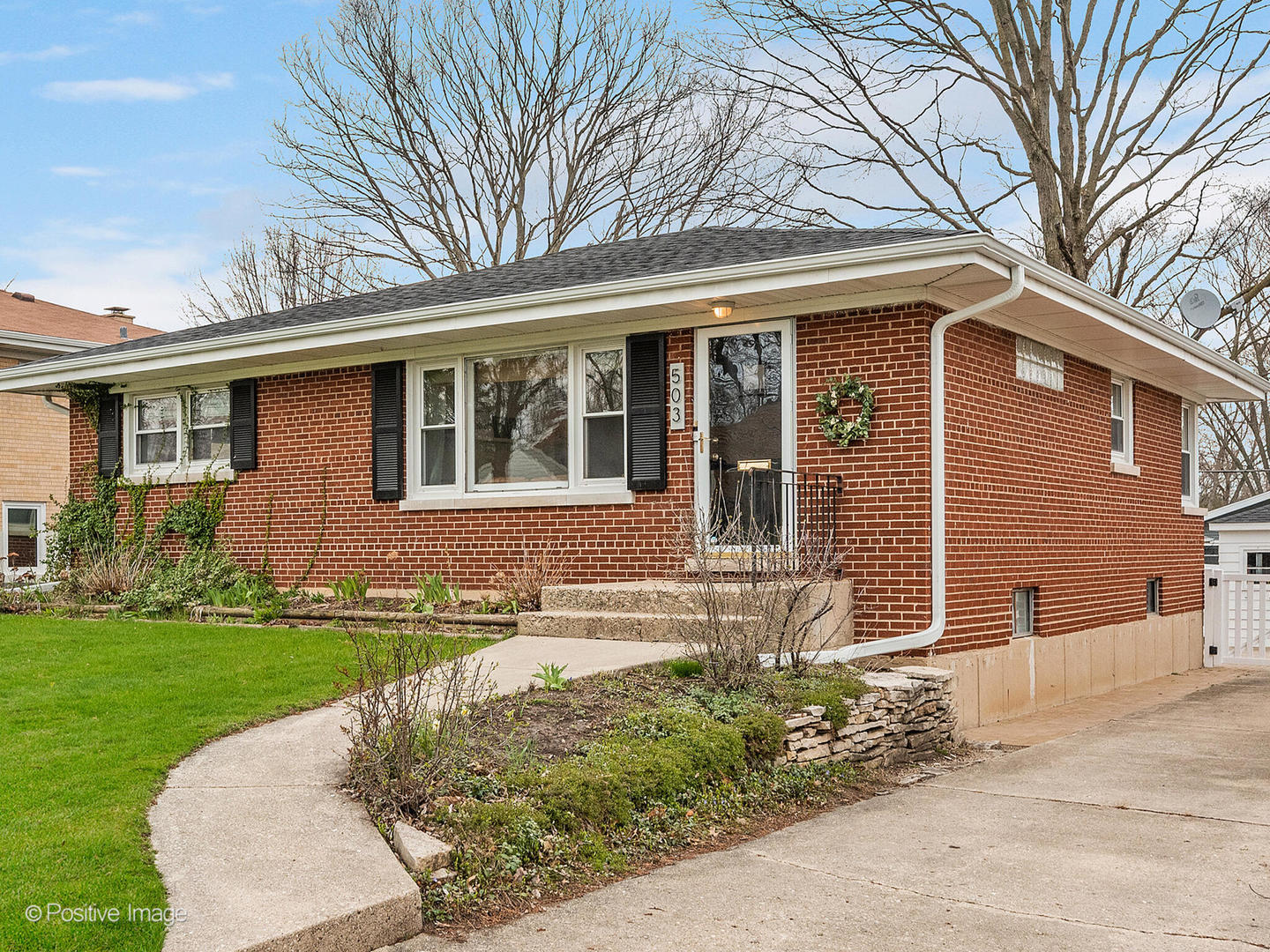 503 Kipling Court Wheaton, IL 60187 - Photo 2 of 27 a front view of a house with a yard