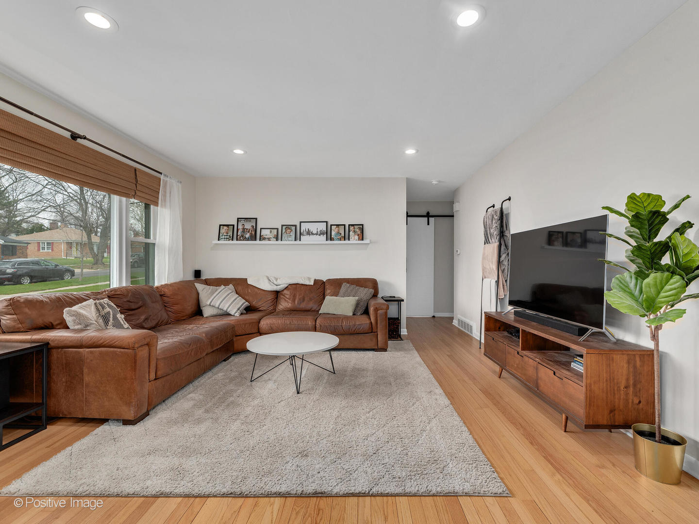 503 Kipling Court Wheaton, IL 60187 - Photo 6 of 27 a living room with furniture and a flat screen tv