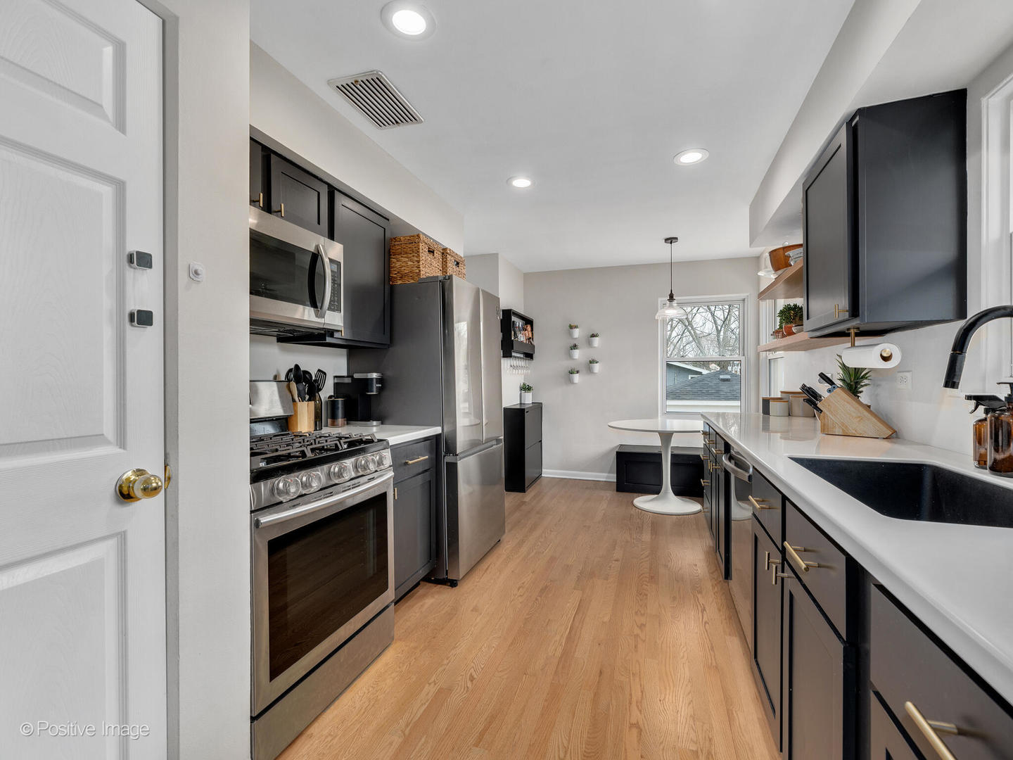 503 Kipling Court Wheaton, IL 60187 - Photo 8 of 27 a kitchen with stainless steel appliances granite countertop a sink stove and refrigerator