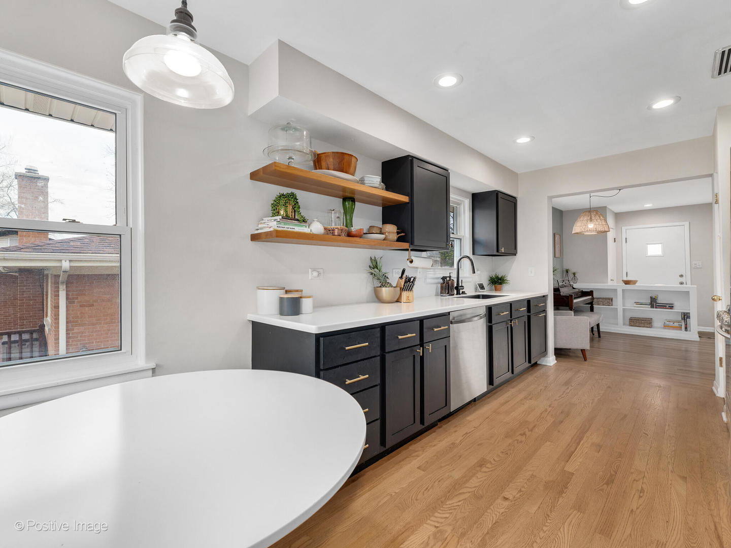 503 Kipling Court Wheaton, IL 60187 - Photo 10 of 27 a large kitchen with kitchen island a sink stainless steel appliances and cabinets