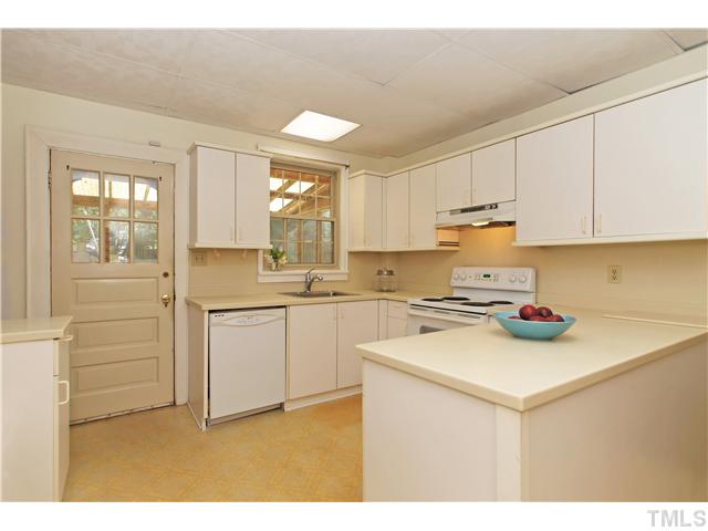 106 North King Charles Road Raleigh, NC 27610 - Photo 11 of 25 Another View Of The Kitchen. The Door Takes You Out To The Screened Porch. Note: The Ceiling Tiles Can Be Removed And The Ceiling Height Is The Same Height As The Rest Of The First Floor.