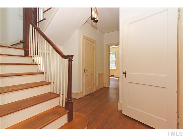 106 North King Charles Road Raleigh, NC 27610 - Photo 12 of 25 The Beautiful Hardwood Floors Adorn The Staircase. There Is Window At The Landing That Allows Natural Light In. The Hallway Takes You To The Downstairs Bedroom And Main Floor Bathroom.