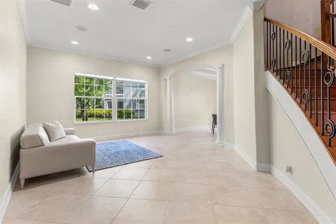 a living room with a couch and a window