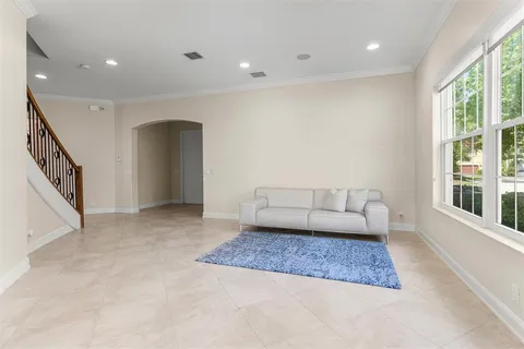 a living room with furniture and a rug