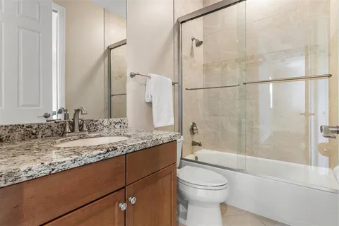 a bedroom with a bed and painting on the wall