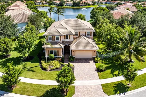 an aerial view of residential house with outdoor space and swimming pool