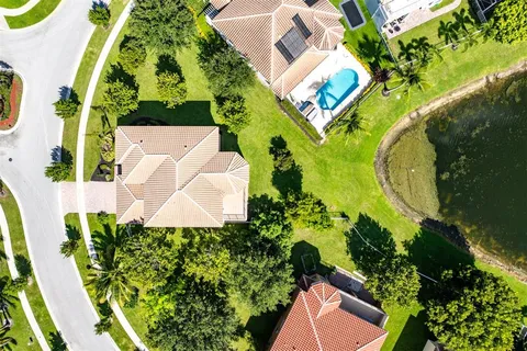 a front view of a house with a yard table and chairs