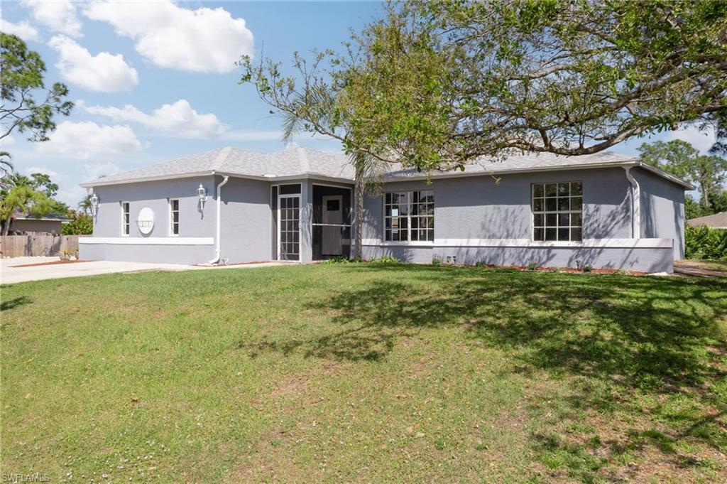 18441 Columbine Road Fort Myers, FL 33967 - Photo 1 of 33 a front view of house with yard and green space