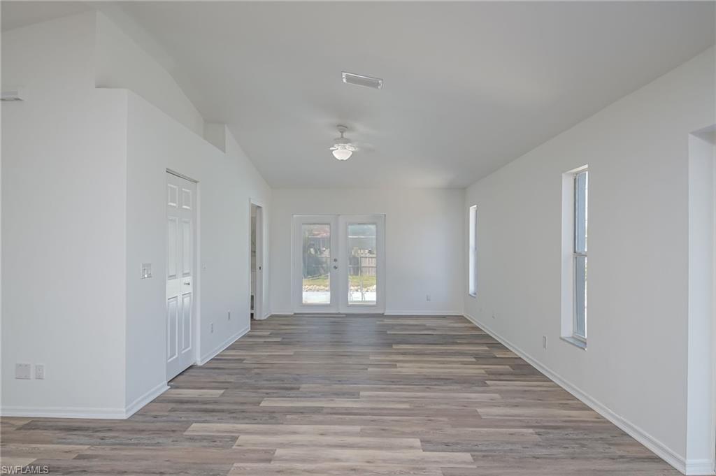 18441 Columbine Road Fort Myers, FL 33967 - Photo 11 of 33 a view of an empty room with window and wooden floor