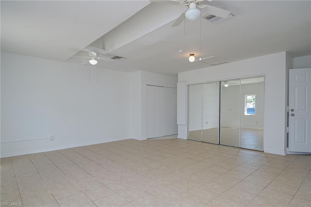 18441 Columbine Road Fort Myers, FL 33967 - Photo 17 of 33 an empty room with fan and fan