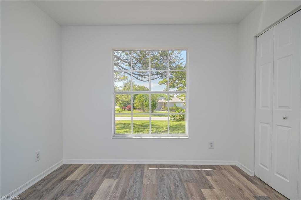 18441 Columbine Road Fort Myers, FL 33967 - Photo 20 of 33 wooden floor in an empty room with a window