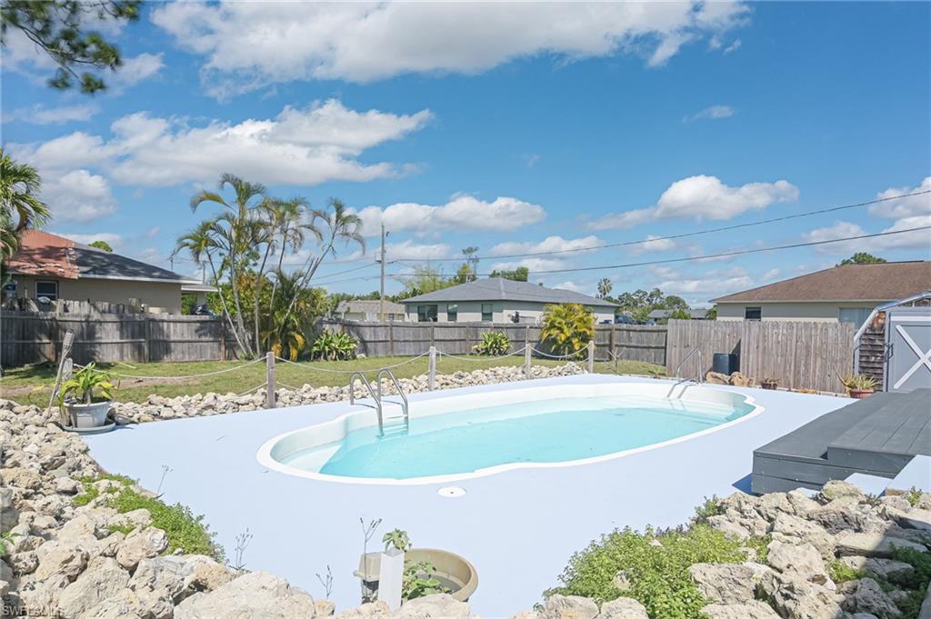 18441 Columbine Road Fort Myers, FL 33967 - Photo 2 of 33 a view of a swimming pool with a patio