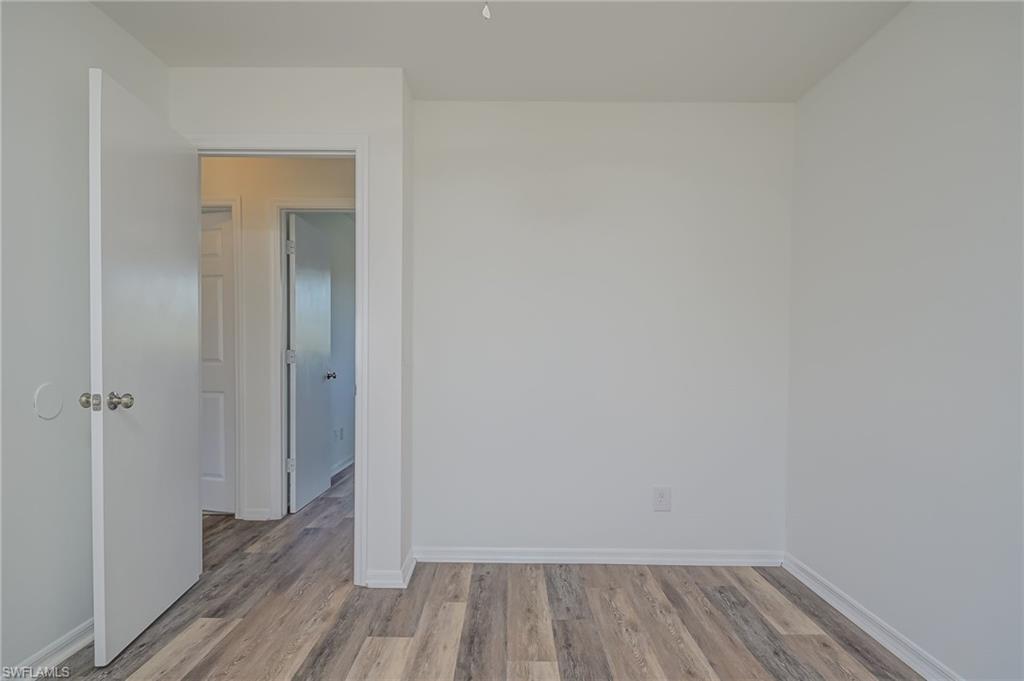 18441 Columbine Road Fort Myers, FL 33967 - Photo 21 of 33 a view of a room with wooden floor