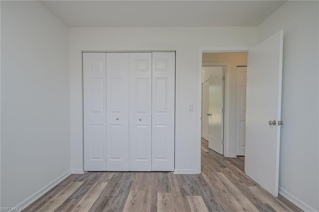 18441 Columbine Road Fort Myers, FL 33967 - Photo 23 of 33 a view of hallway with wooden floor