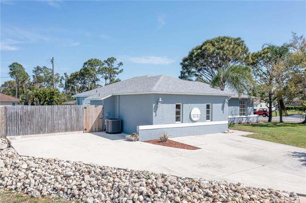 18441 Columbine Road Fort Myers, FL 33967 - Photo 28 of 33 a front view of a house with a yard and garage