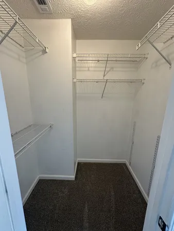 a view of a room with racks on the wall