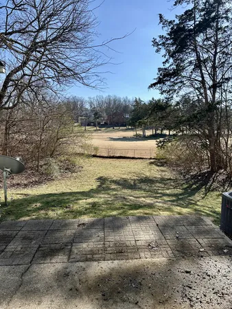 a view of a lake with a yard