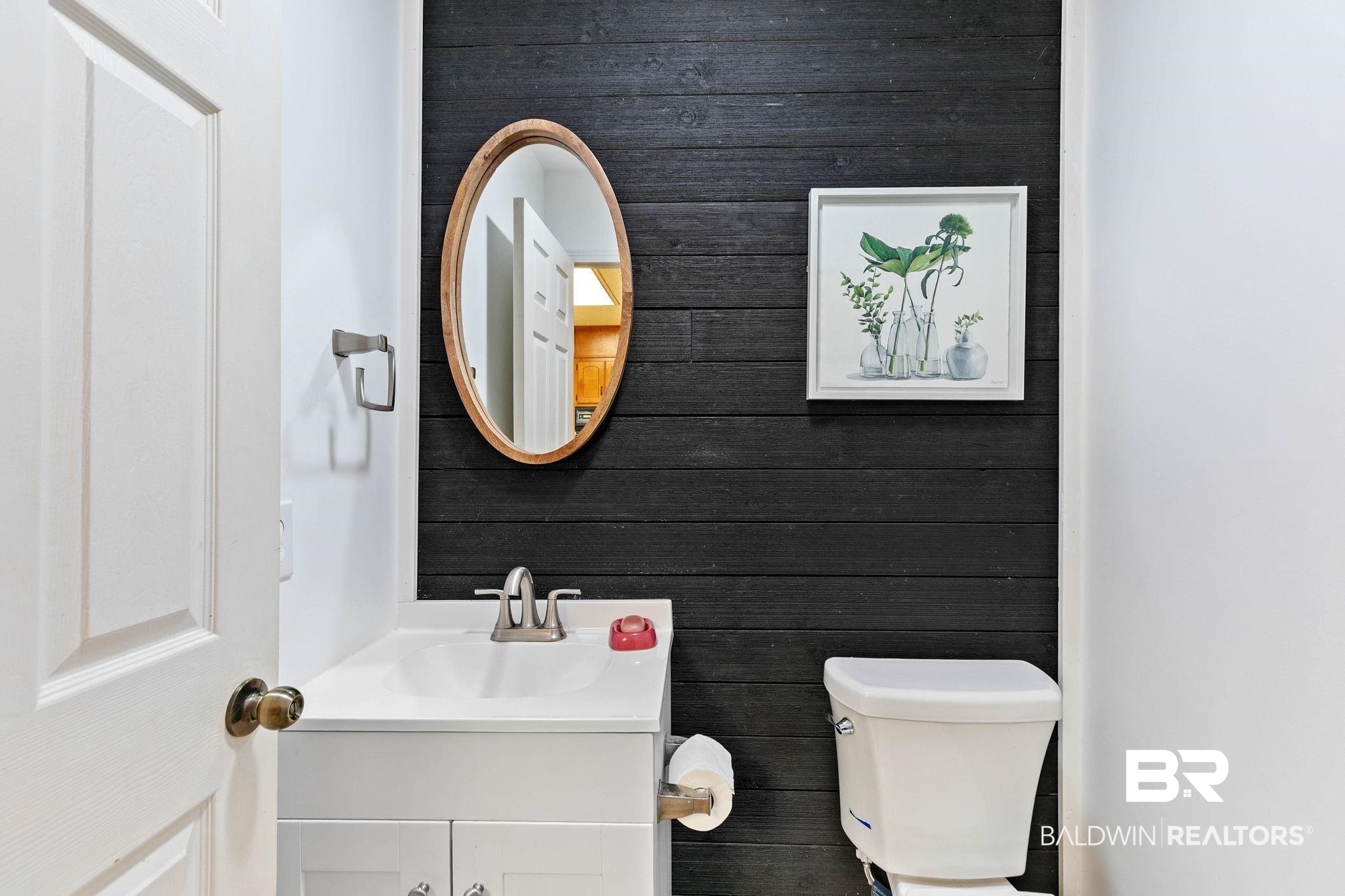 1510 South Juniper Street Foley, AL 36535 - Photo 16 of 36 Half bath featuring vanity and toilet