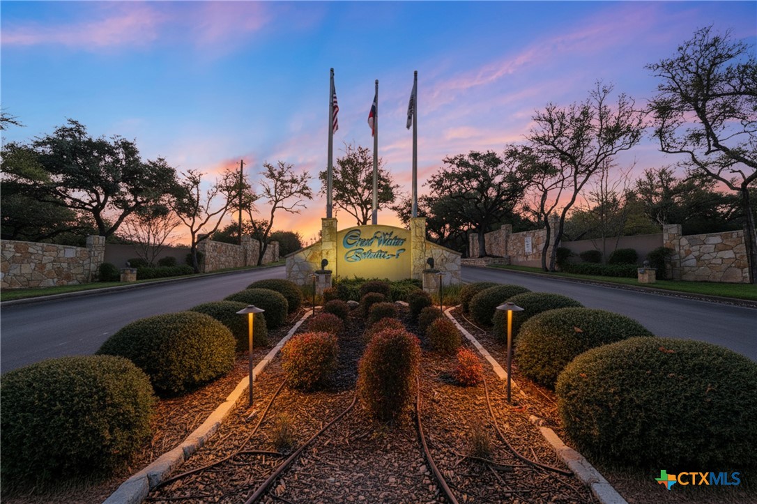 a view of swimming pool outdoor seating and city view