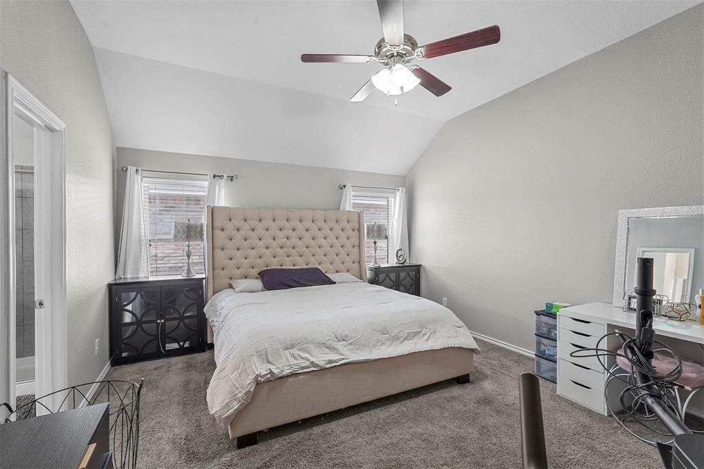 1948 Day Break Drive Lancaster, TX 75146 - Photo 14 of 25 a bedroom with a large bed and a chandelier