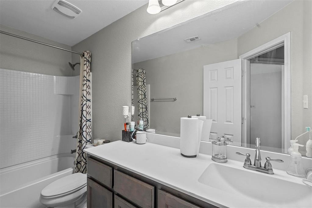 1948 Day Break Drive Lancaster, TX 75146 - Photo 18 of 25 a bathroom with a sink a toilet and shower