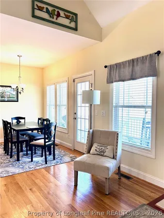 a view of staircase with railing and white walls