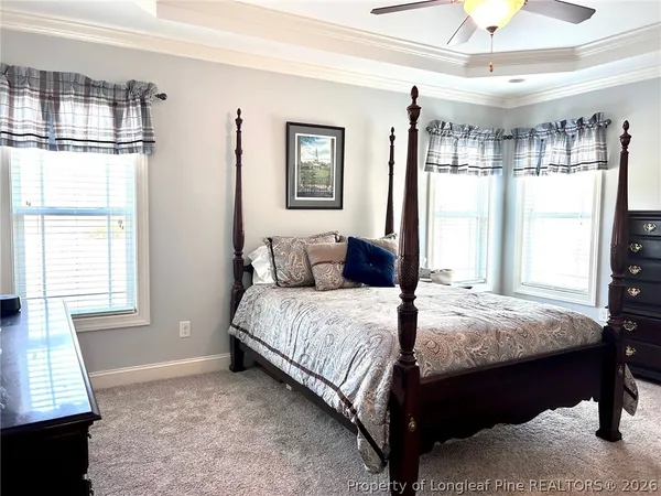 a bathroom with a granite countertop sink mirror and a bathtub