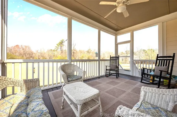 a view of a livingroom with furniture stairs