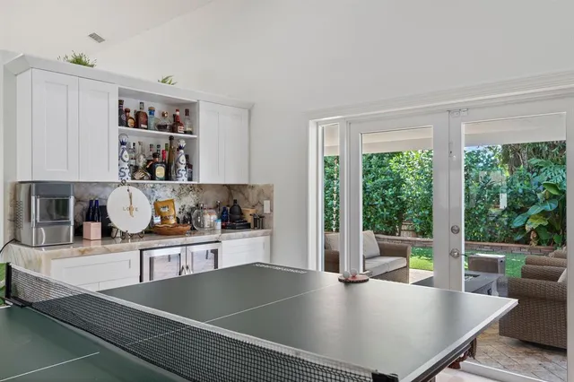 a living room with hard wood floor and a table