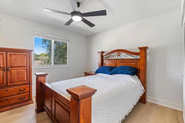 a bedroom with a bed and a dresser