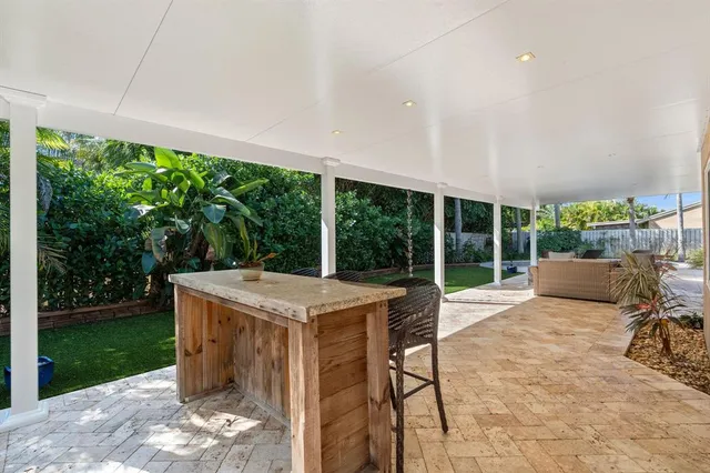 a view of a patio with a backyard