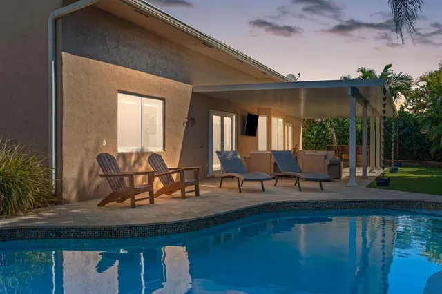 a view of a balcony with chairs and a table