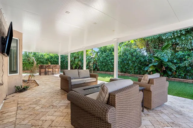 a outdoor space with patio the couches and a dining table with garden view