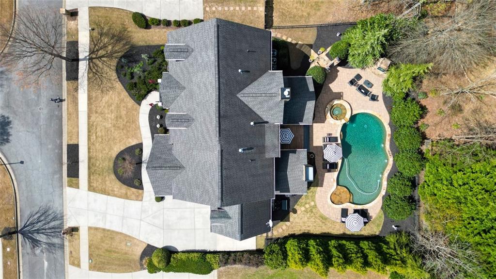 3435 Hidden Shoals Road Northeast Buford, GA 30519 - Photo 101 of 108 an aerial view of a swimming pool with outdoor seating and yard