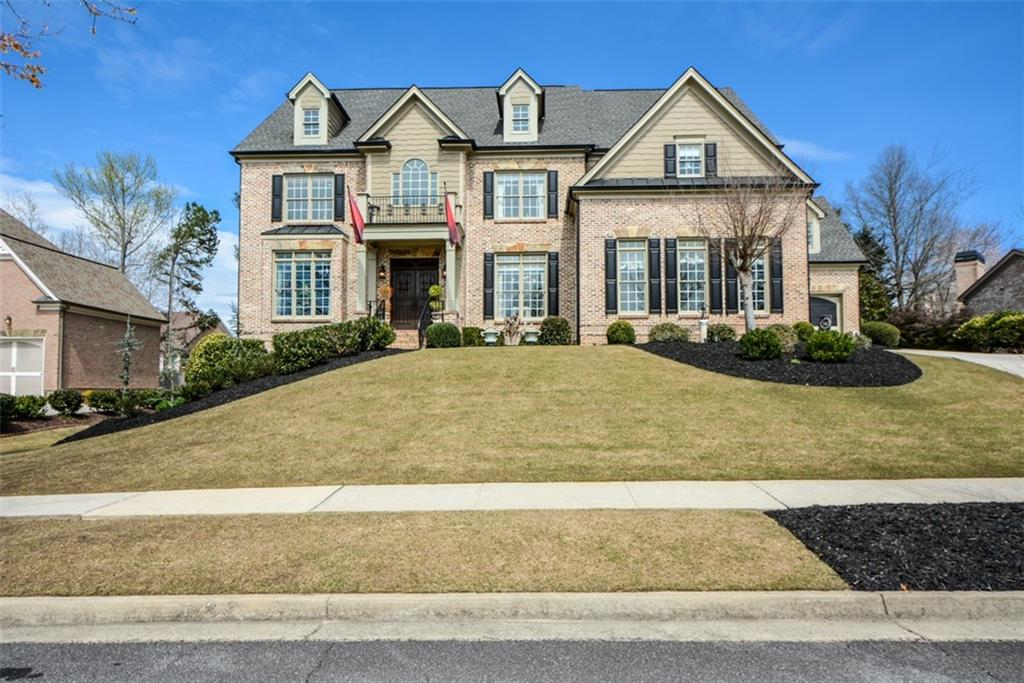 3435 Hidden Shoals Road Northeast Buford, GA 30519 - Photo 2 of 108 a front view of a house with garden