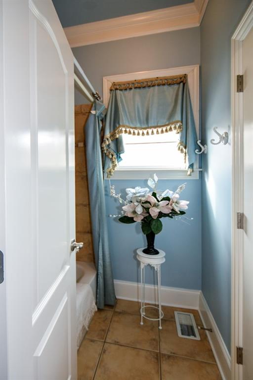 3435 Hidden Shoals Road Northeast Buford, GA 30519 - Photo 22 of 108 a bathroom with a toilet and a shower