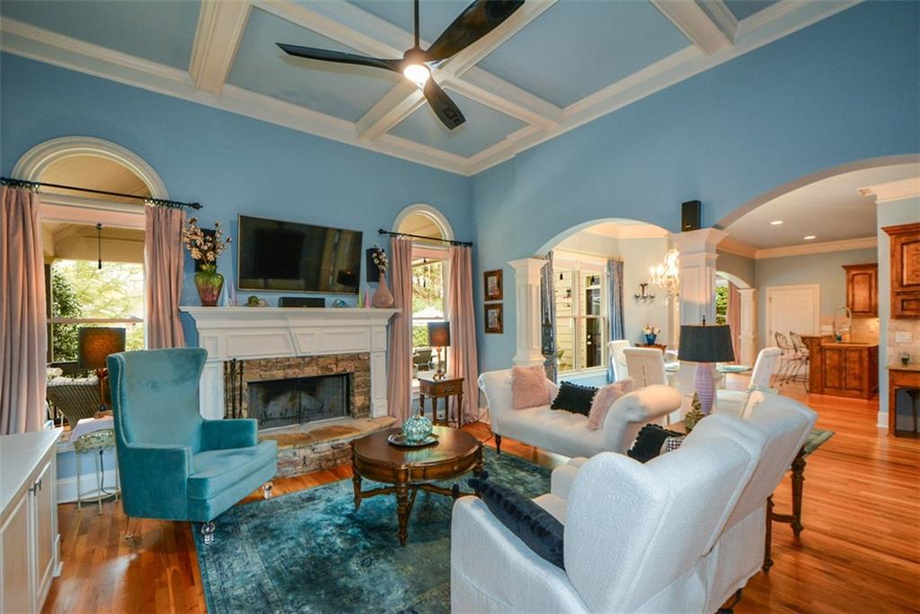 3435 Hidden Shoals Road Northeast Buford, GA 30519 - Photo 24 of 108 a living room with furniture fireplace and a flat screen tv