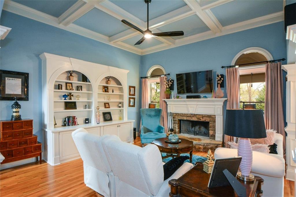 3435 Hidden Shoals Road Northeast Buford, GA 30519 - Photo 25 of 108 a living room with furniture fireplace and flat screen tv