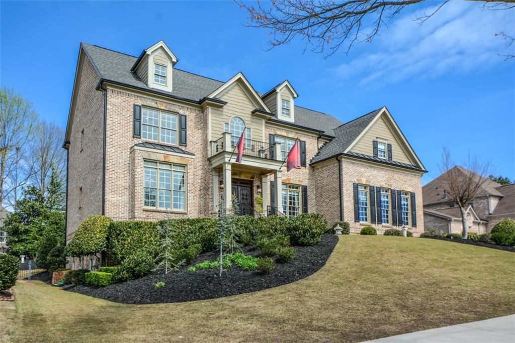 3435 Hidden Shoals Road Northeast Buford, GA 30519 - Photo 3 of 108 a front view of a house with garden