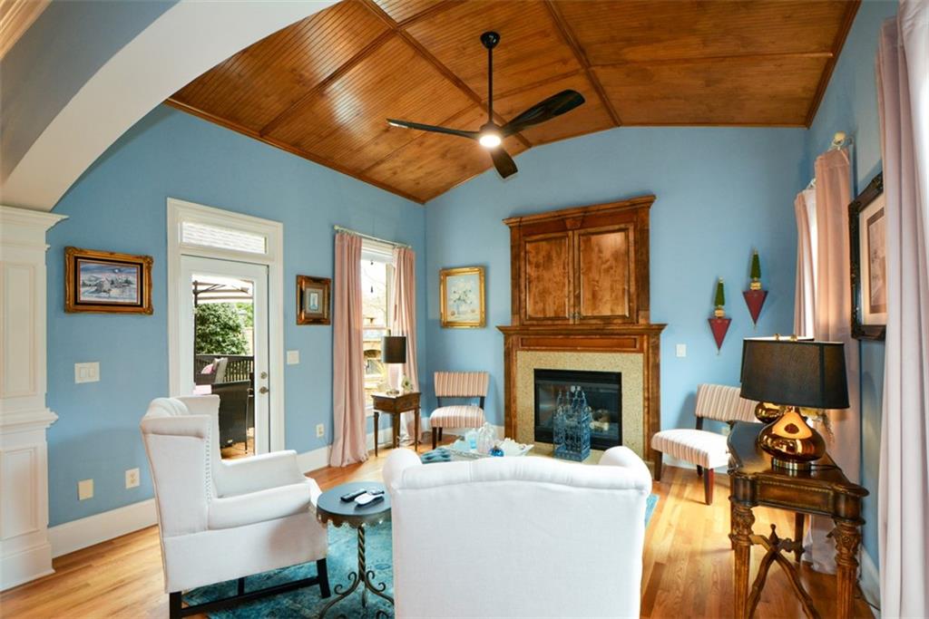 3435 Hidden Shoals Road Northeast Buford, GA 30519 - Photo 40 of 108 a living room with furniture a fireplace and a flat screen tv