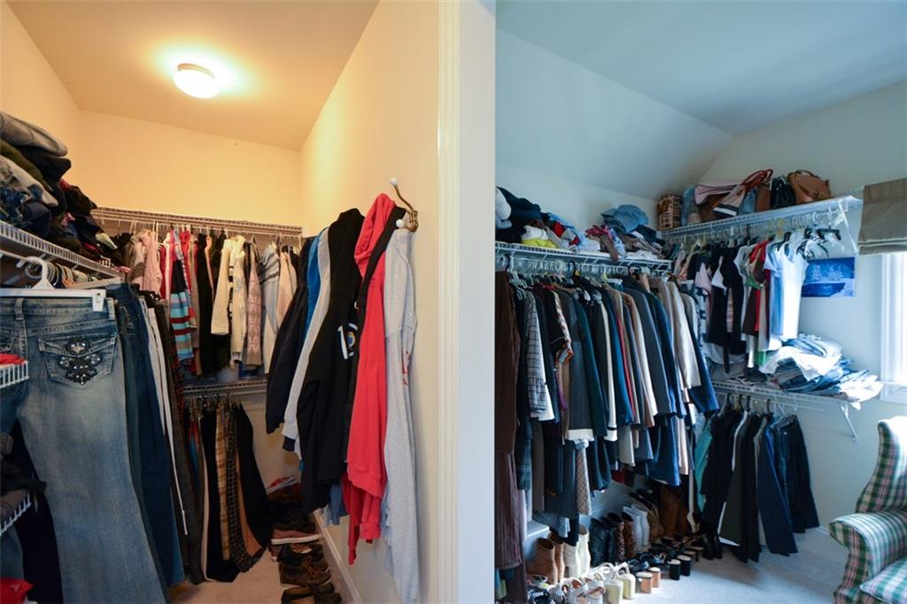3435 Hidden Shoals Road Northeast Buford, GA 30519 - Photo 59 of 108 a view of walk in closet with clothes