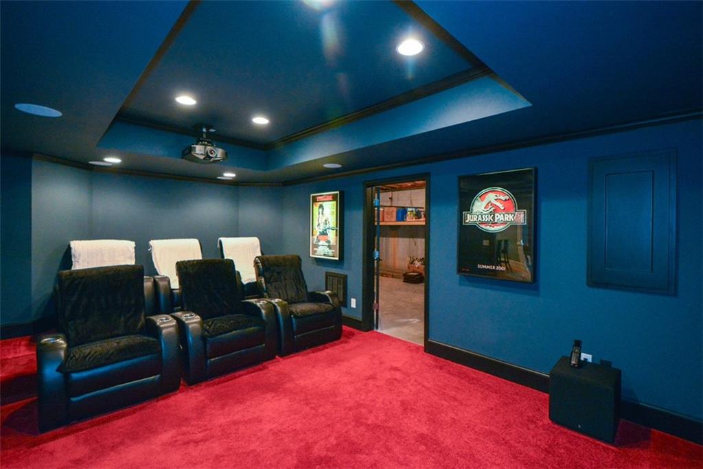 3435 Hidden Shoals Road Northeast Buford, GA 30519 - Photo 77 of 108 a living room with furniture and a flat screen tv