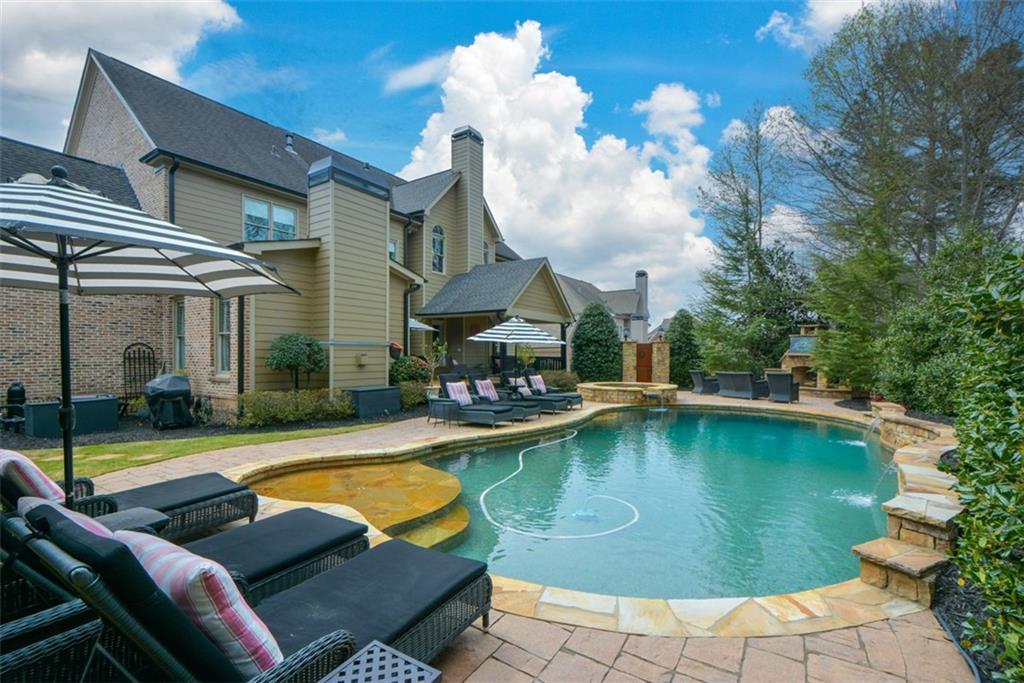 3435 Hidden Shoals Road Northeast Buford, GA 30519 - Photo 87 of 108 a view of a swimming pool with lounge chair