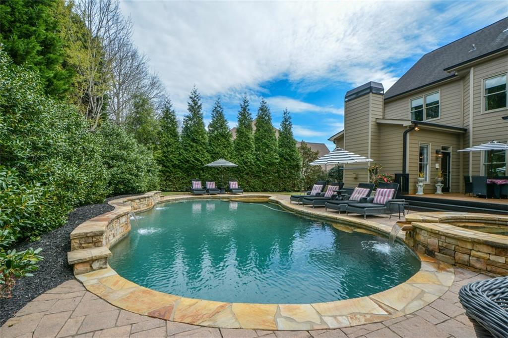 3435 Hidden Shoals Road Northeast Buford, GA 30519 - Photo 89 of 108 a view of a swimming pool with lounge chair