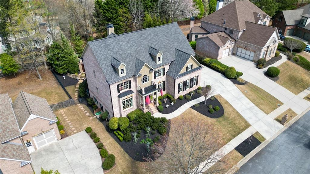 3435 Hidden Shoals Road Northeast Buford, GA 30519 - Photo 99 of 108 an aerial view of a house with swimming pool and large trees