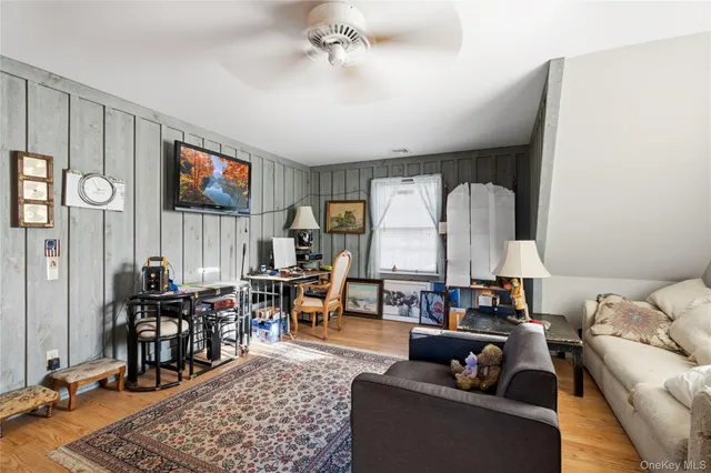 a living room with furniture and a rug