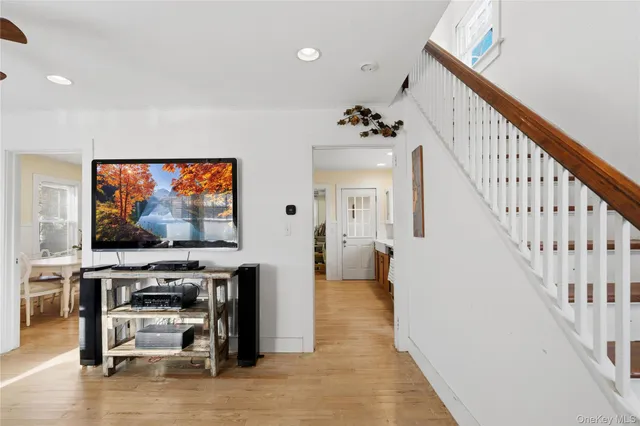 a view of a livingroom with furniture and a flat screen tv